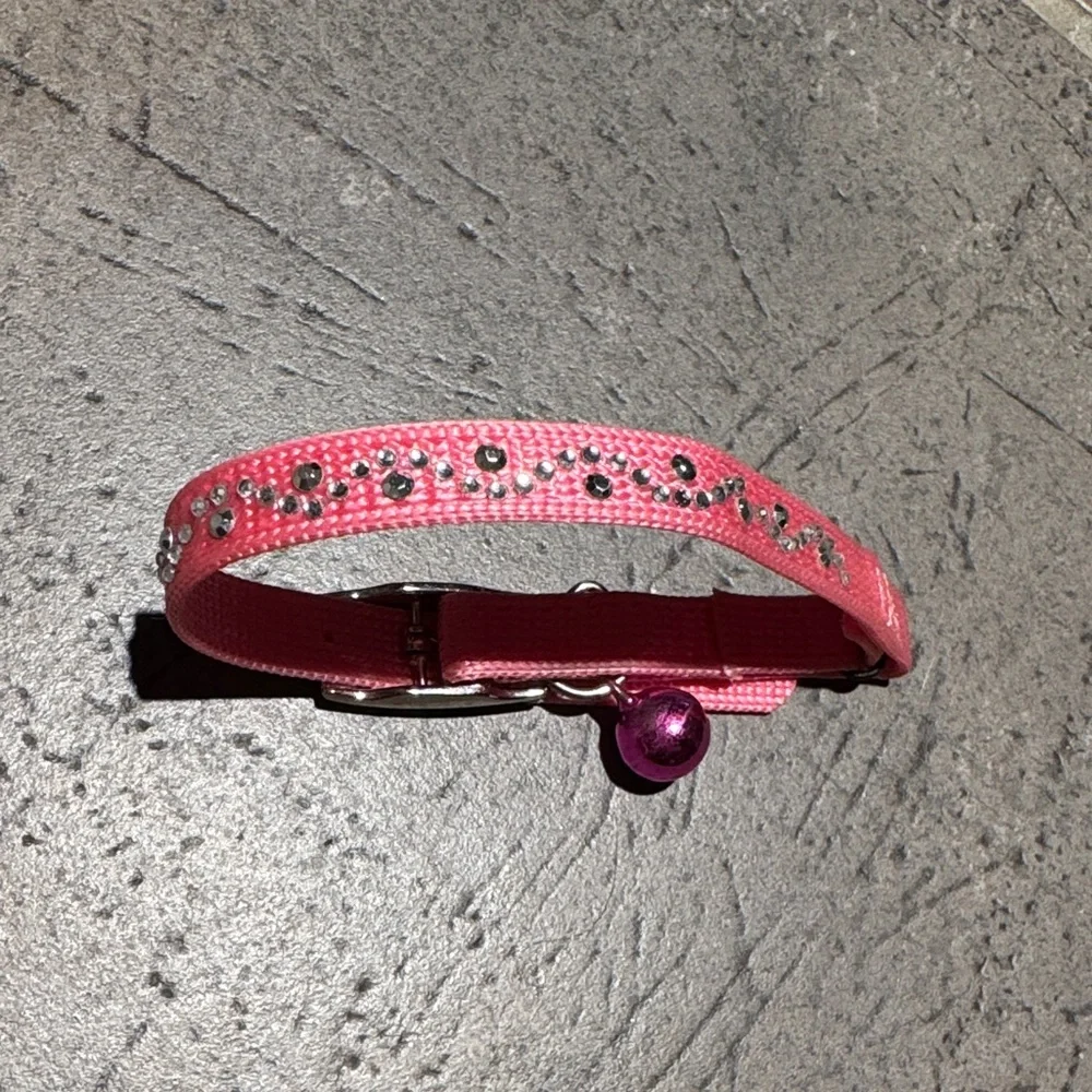 Pink Rhinestone Cat Collar or small dog, adorned with rhinestones and a bell.